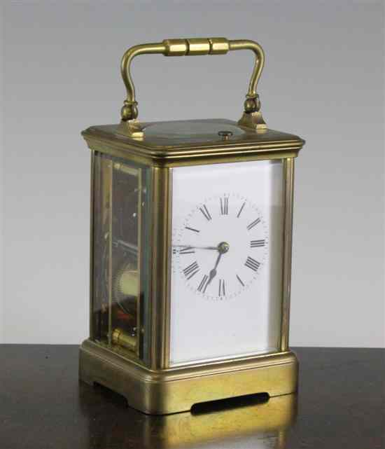 An Edwardian brass hour repeating carriage clock with enamelled Roman