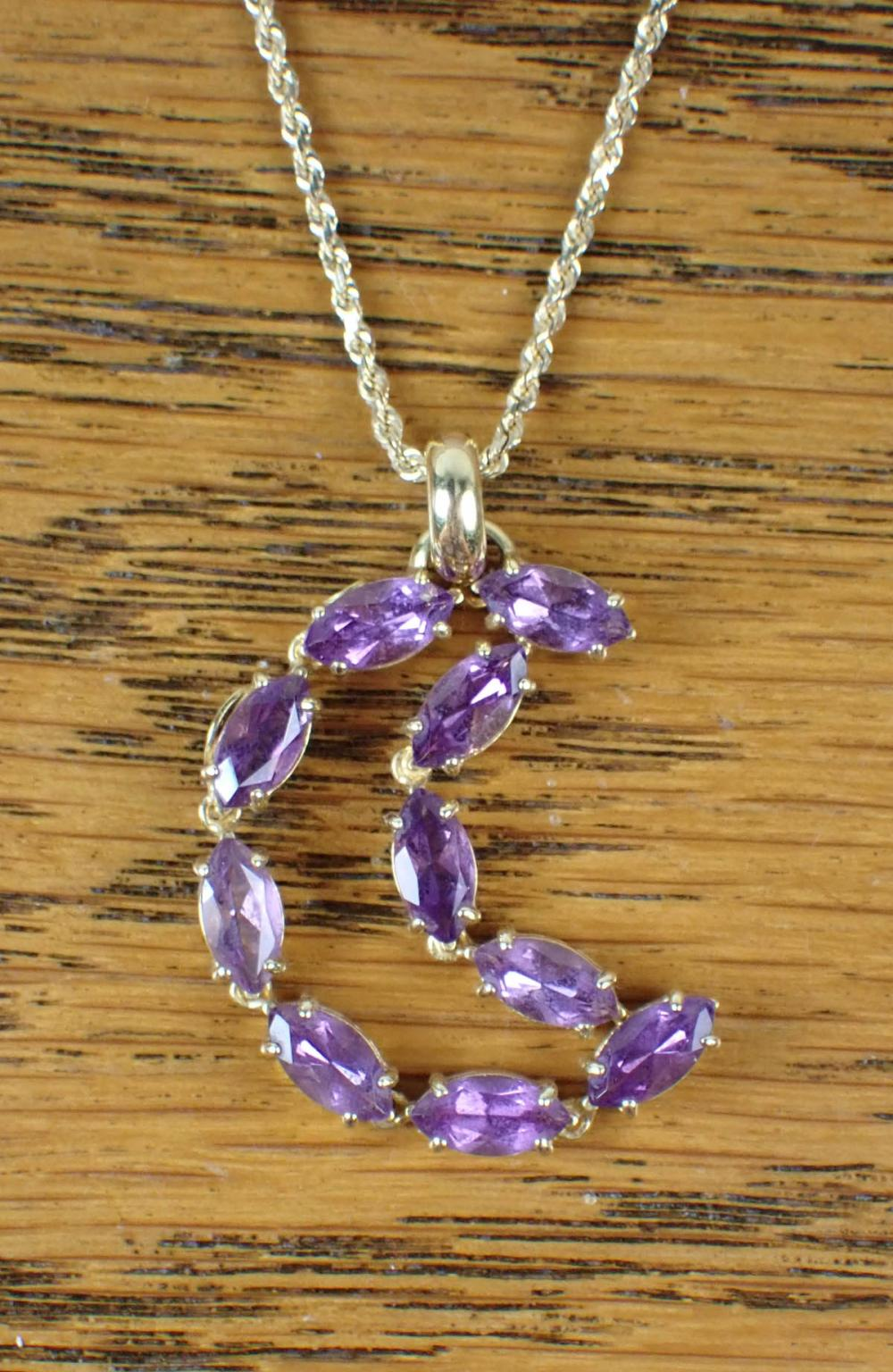 AMETHYST AND FOURTEEN KARAT GOLD PENDANT NECKLACE with an 18