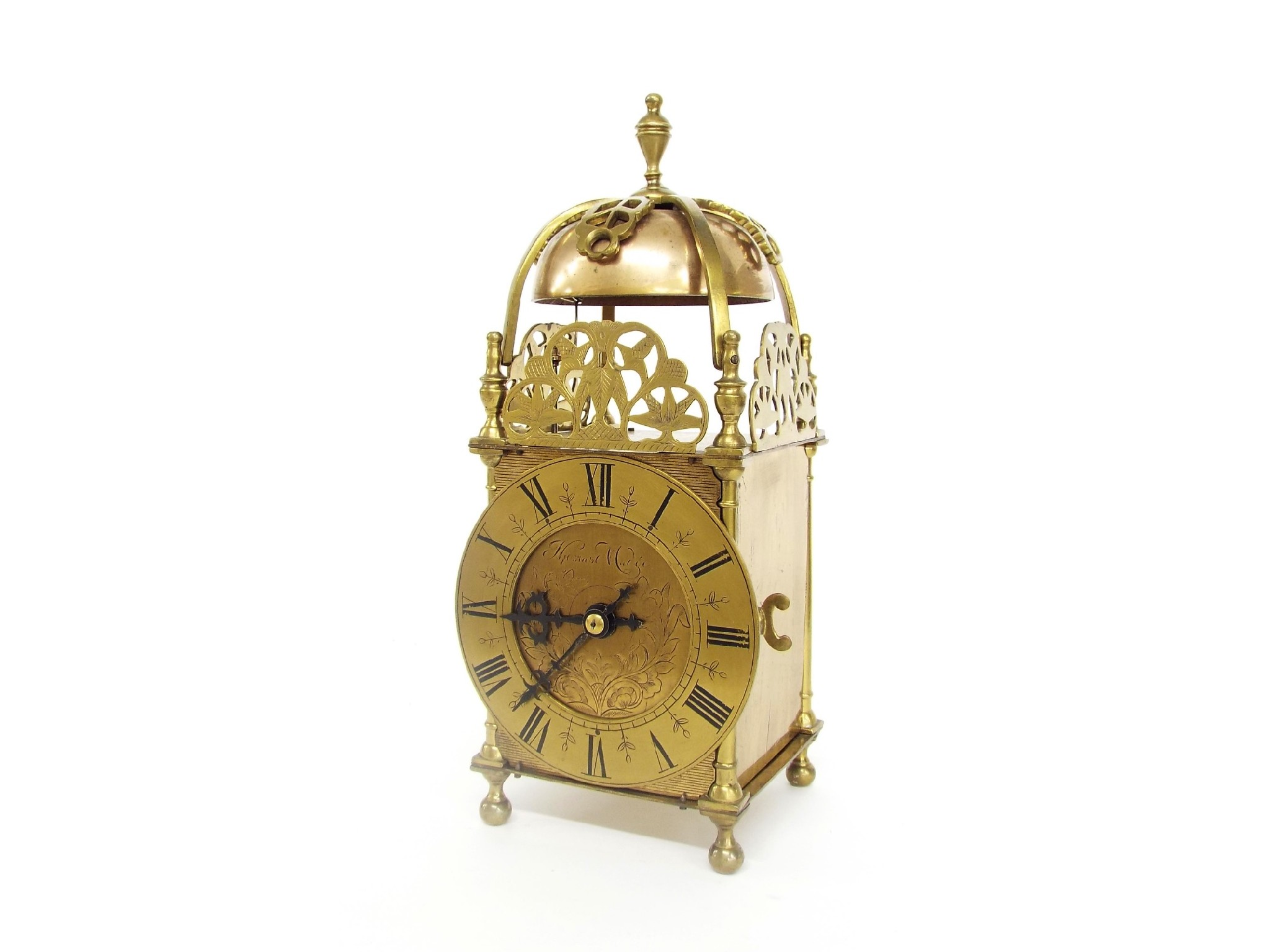 Brass two train lantern clock striking on a bell the