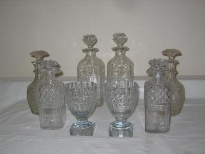 A PAIR OF DECANTERS AND STOPPERS of mallet form with