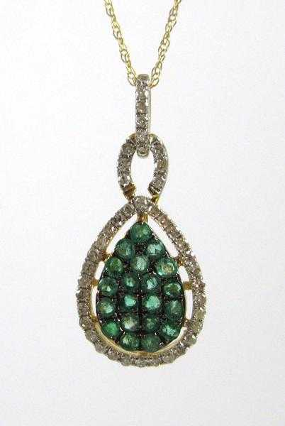 EMERALD AND DIAMOND PENDANT NECKLACE suspended on an 18 inch