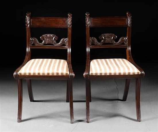 Pair of American Classical mahogany slip seat upholstered klismos chairs