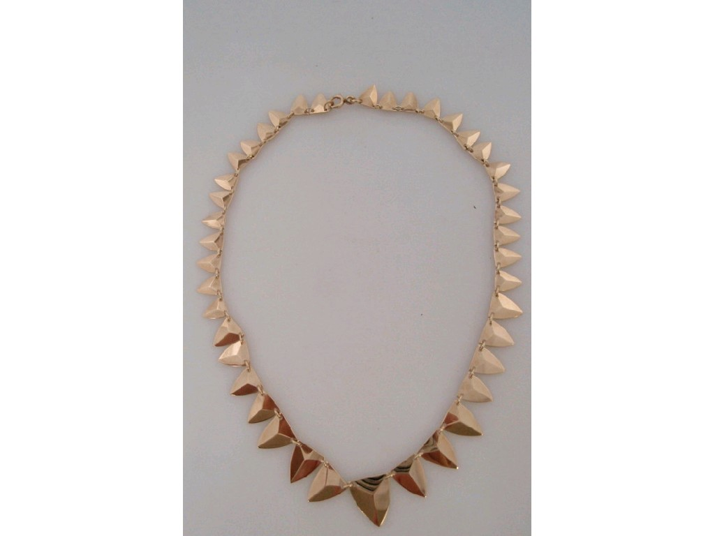 A 9ct gold necklace of graduated shield shaped links Birmingham