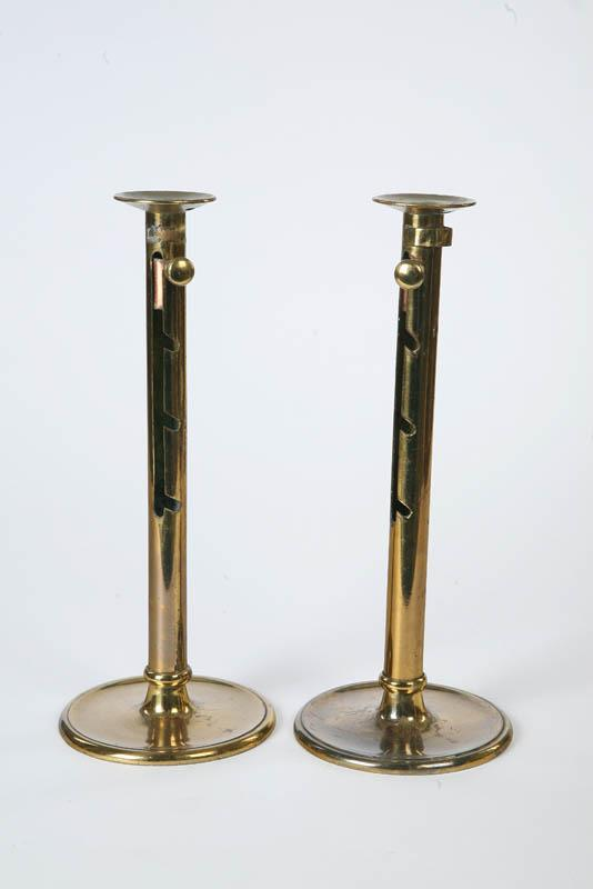 PAIR OF BRASS CANDLESTICKS Large cylindrical sticks with drip pans
