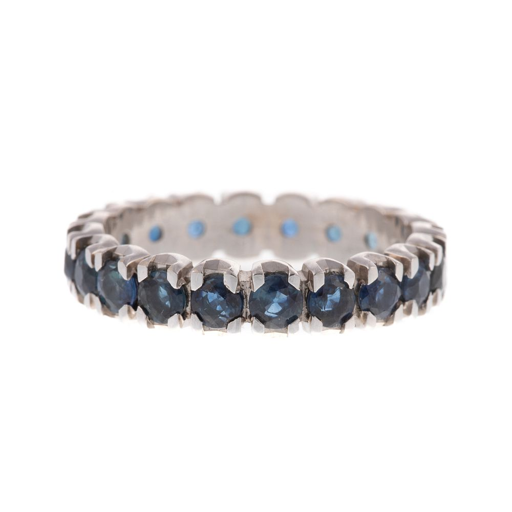 A Sapphire Eternity Band in 14K 14K white gold eternity