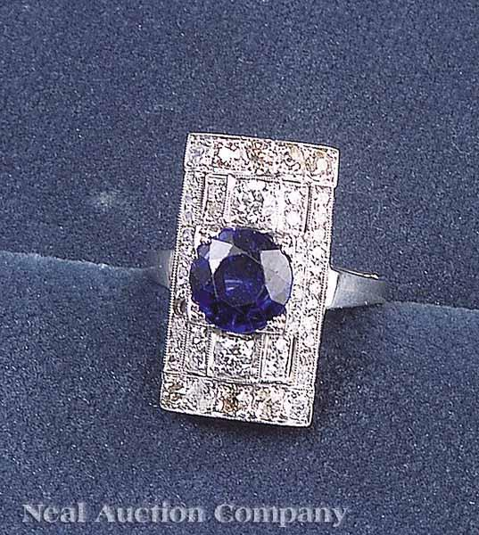 An Art Deco Style Platinum Diamond and Synthetic Sapphire Dinner