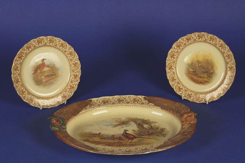 A ROYAL WORCESTER VITREOUS CHINA GAME SERVICE comprising oval serving
