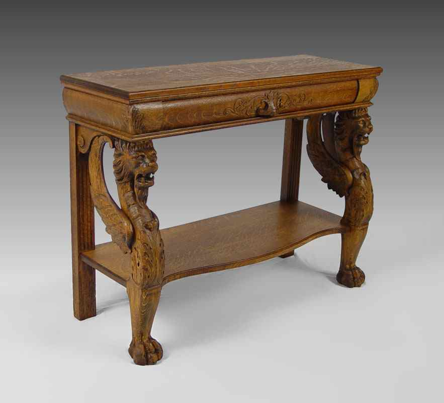 CARVED OAK GRIFFIN CONSOLE TABLE Single drawer table with three