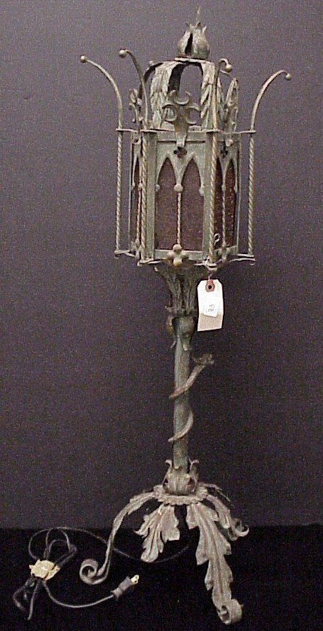 Gothic style metal lamp with three amber glass panels one