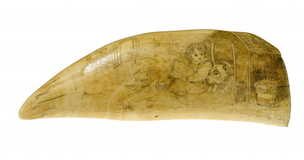 SCRIMSHAW A WHALE S TOOTH decorated with a child seated