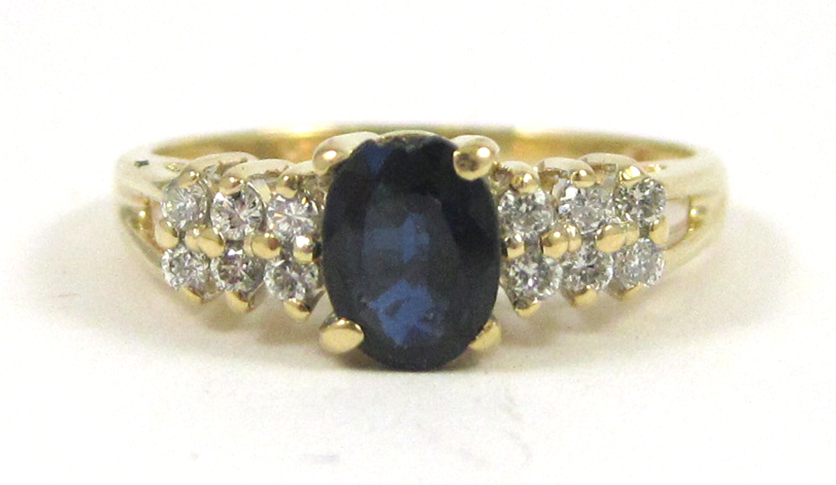 SAPPHIRE DIAMOND AND FOURTEEN KARAT GOLD RING with six round