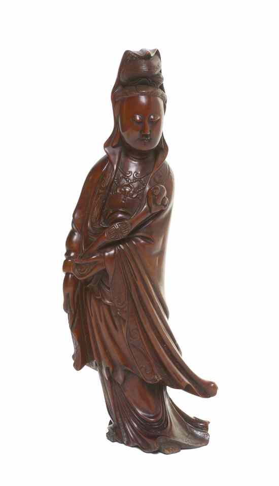 A Chinese Carved Hardwood Figure of Guanyin 18th 19th century