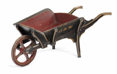A small 19th century painted wood wheelbarrow of typical form