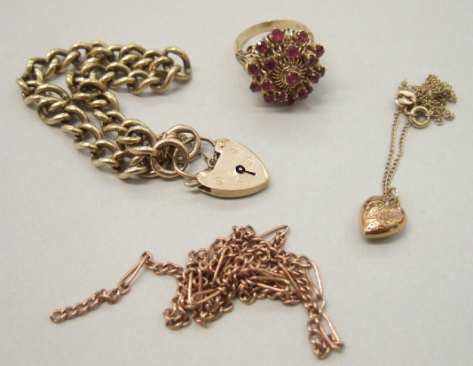 A 9ct gold curb link bracelet on a 9ct gold