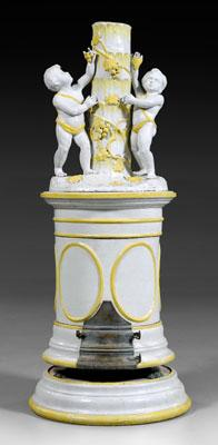 Italian majolica figural stove in five sections top with putti