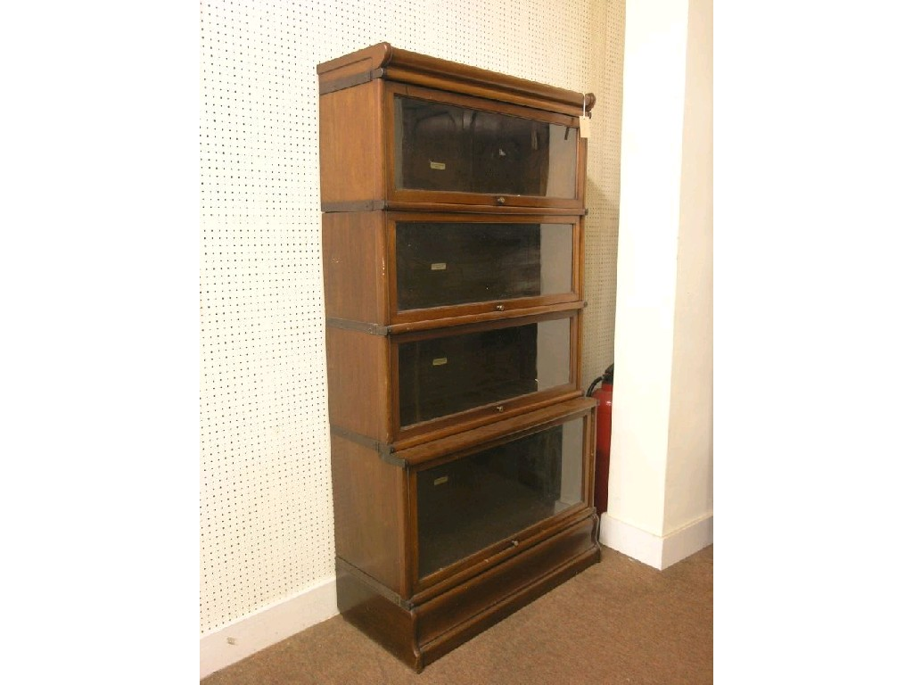 A Globe Wernicke walnut sectional bookcase four glazed sections 2ft