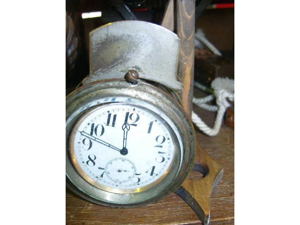 An Edwardian silver plated watch set within a silver plated