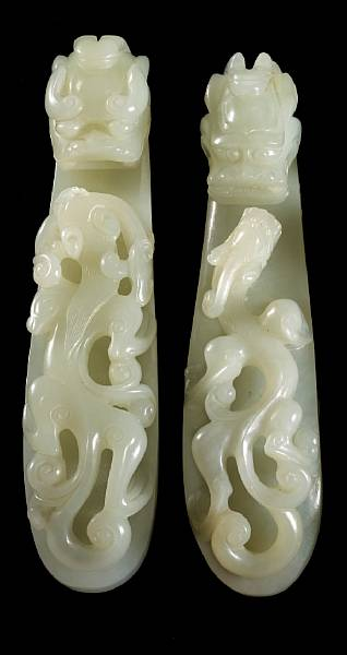 Two pale greenish white jade belt hooks 18th Century Each