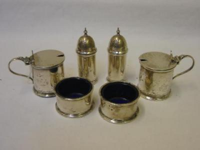 A SIX PIECE CONDIMENT SET of cylindrical form with moulded