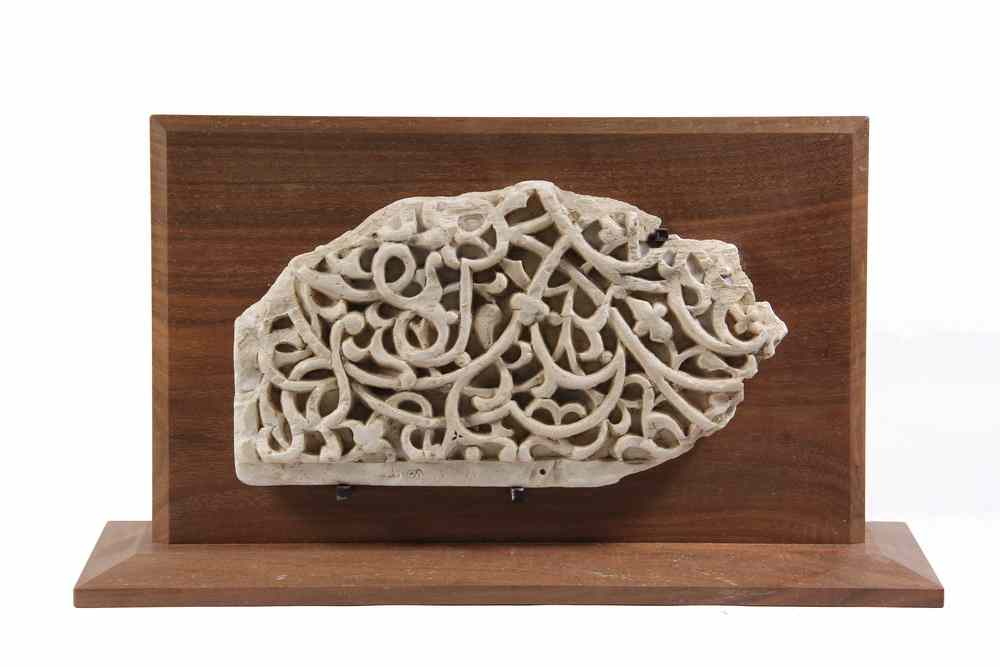 ISLAMIC STONE CARVING fragmentary part of a larger panel featuring
