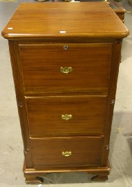 A Victorian style mahogany file cabinet ensuite with previous lot