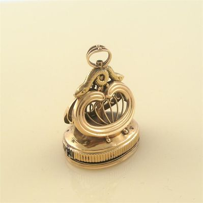 A gold musical fob seal the oval plain matrix with