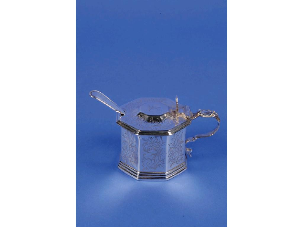 A VICTORIAN MUSTARD POT of octagonal form with leaf capped