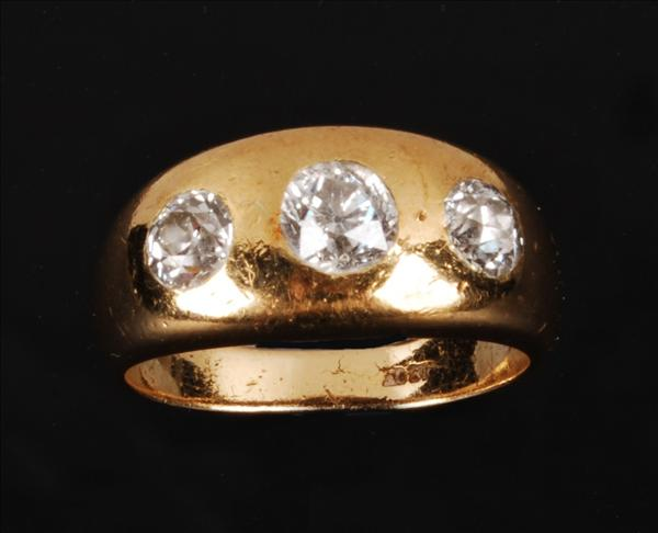 A diamond three stone gipsy ring the slightly graduated old