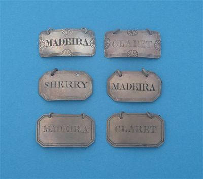 A pair of canted and reeded labels MADEIRA and CLARET