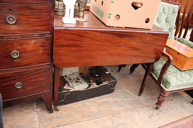 A MAHOGANY DROP LEAF PEMBROKE TABLE square tapering legs terminating