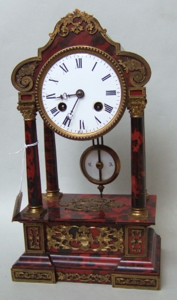 A French mantel clock late 19th century with tortoiseshell case