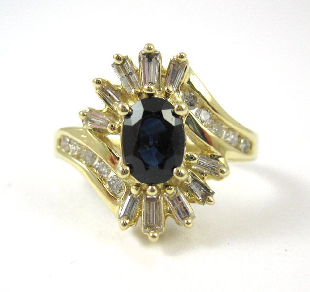 SAPPHIRE DIAMOND AND FOURTEEN KARAT GOLD RING with ten round