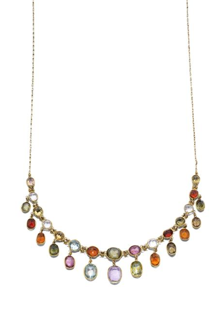 An Edwardian multi gem set necklace of fringed design collet