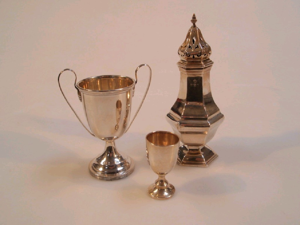 A hexagonal silver sugar castor Birmingham 1919 and two silver