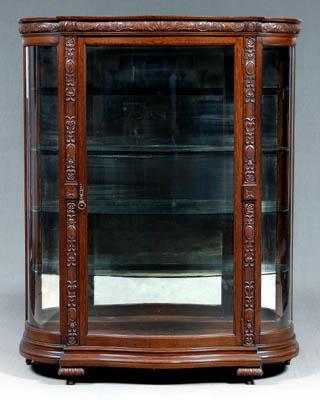 Carved oak curved glass vitrine curved glass central door opening