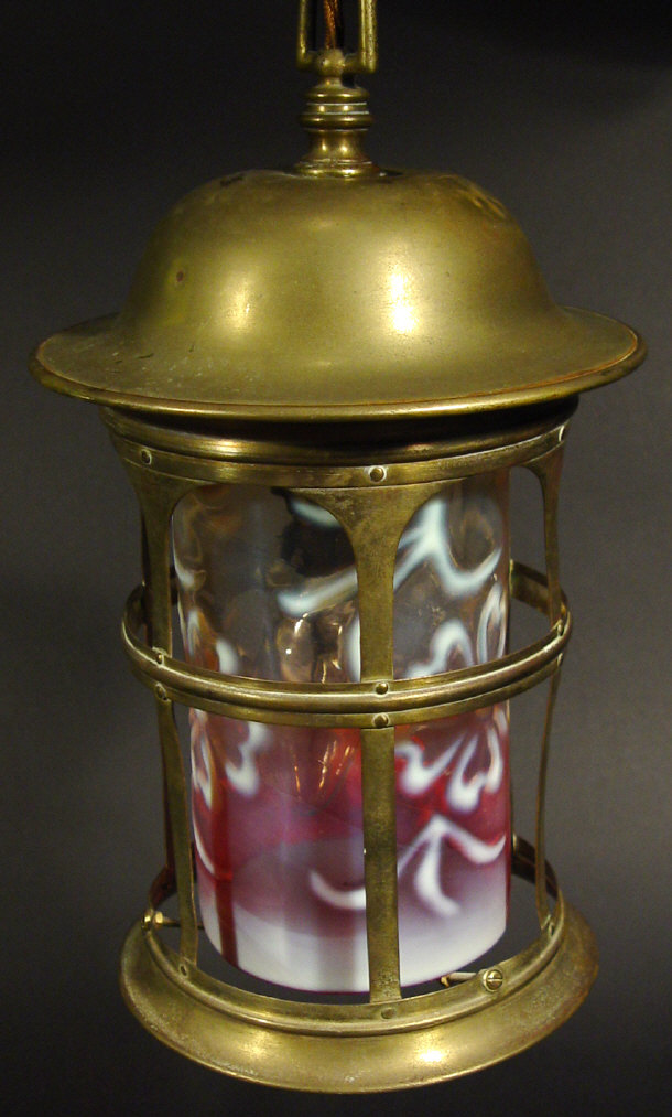 Brass lantern style ceiling light with cylindrical floral moulded cranberry