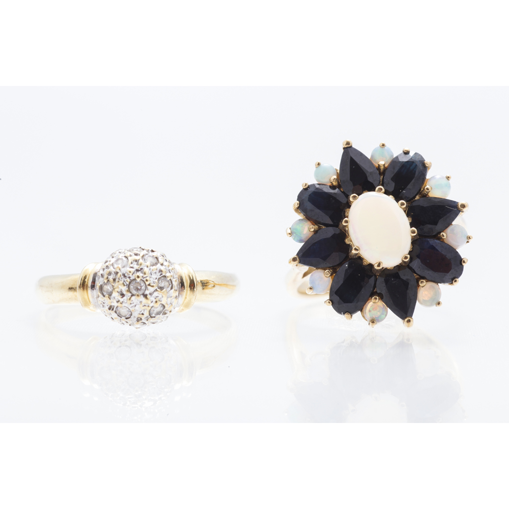 A sapphire and opal set cocktail ring claw set with