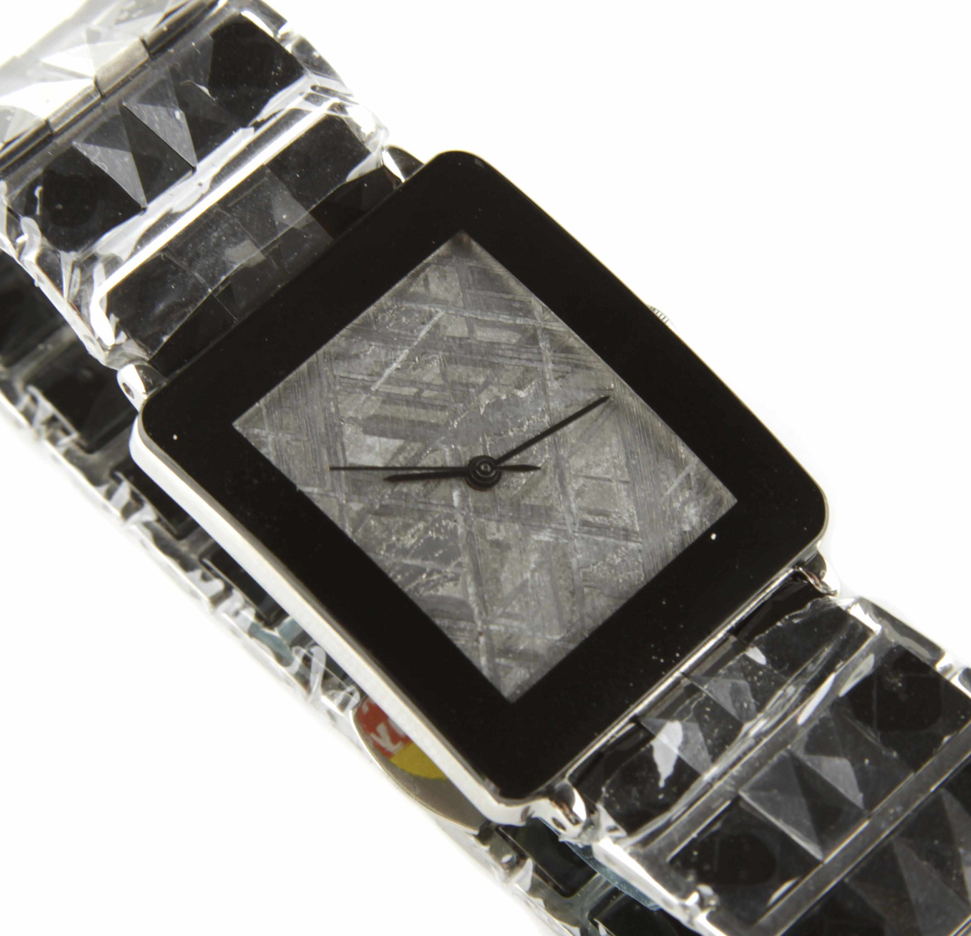 Gibeon Meteorite Watch on Hematite Band The rectangular face composed