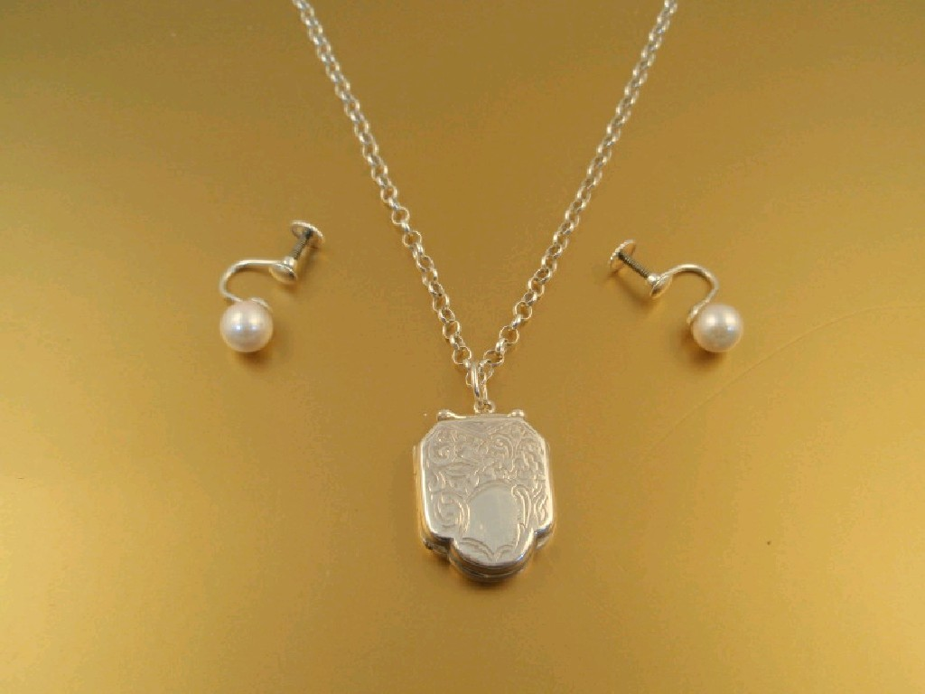 A silver locket and chain and a pair of screw