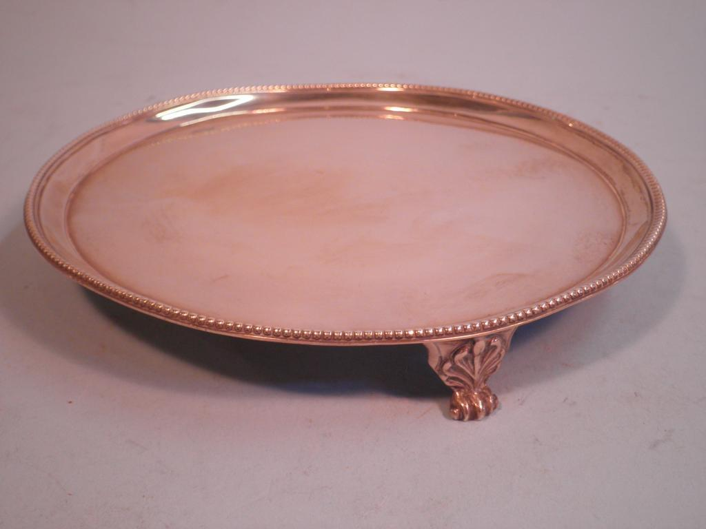 A George III silver waiter with beaded border and acanthus
