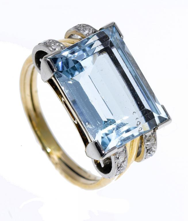 A BLUE ZIRCON AND DIAMOND RING the step cut zircon