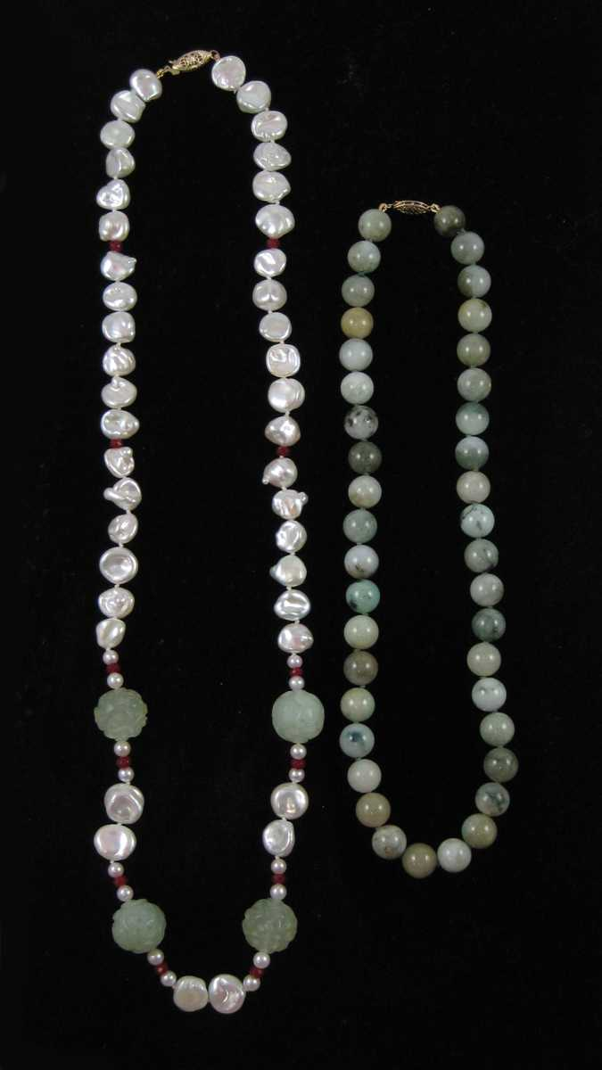 TWO JADE AND FOURTEEN KARAT GOLD NECKLACES including a 25