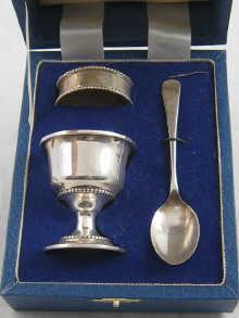A boxed silver Christening set of eggcup spoon and napkin