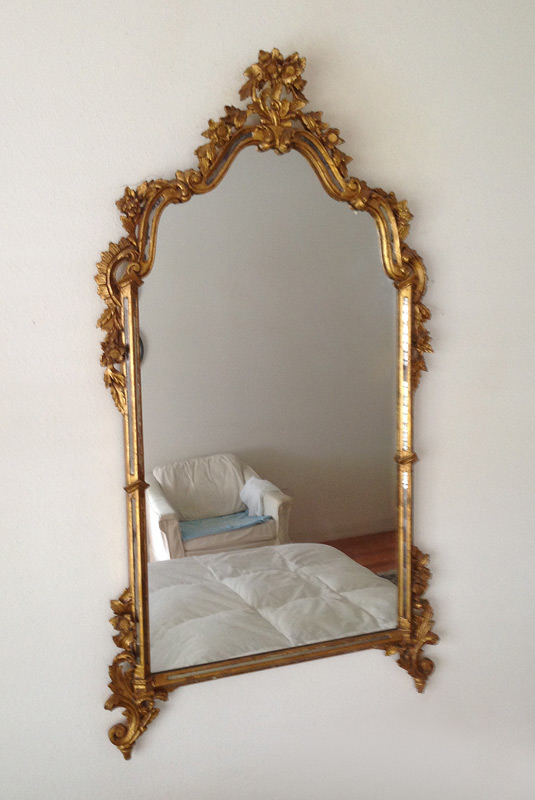 CARVED GILT WOOD WALL MIRROR Frame carved with floral and