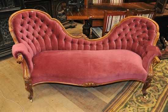 A VICTORIAN WALNUT BUTTON BACK SETTEE IN DUSTY PURPLE VELVET