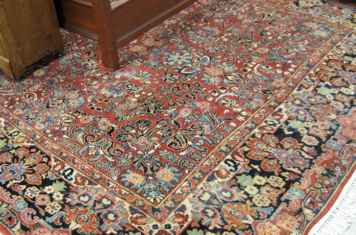 SEMI ANTIQUE PERSIAN SAROUK CARPET overall floral design on red