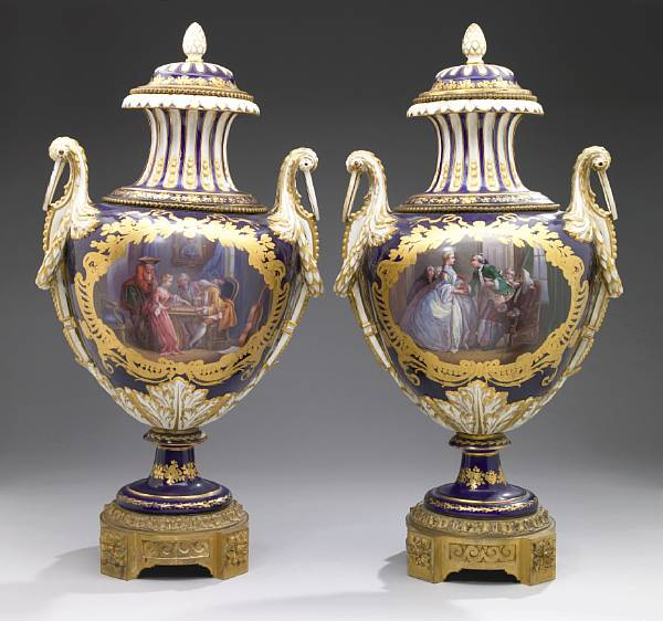 A pair of Sevres style earthenware gilt bronze mounted two