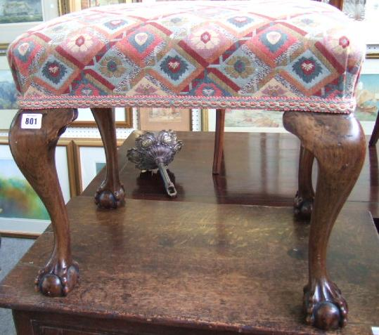 A stained beech stool with cabriole legs and ball and