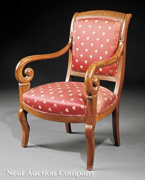 An Empire Carved Walnut Fauteuil early 19th c shaped crest