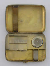 A plain combination silver cigarette case sovereign case and vesta